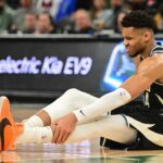 Milwaukee Bucks forward Giannis Antetokounmpo (34) grabs his leg in the third quarter and left game against the Boston Celtics with an injury at Fiserv Forum.