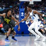 Jazz guard Collin Sexton (2) dribbles as Dallas Mavericks guard Jazian Gortman (00) defends