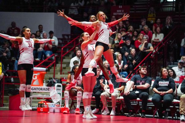 Abby Horner lifts Lola Schumacher into the air as Badgers defeat Marquette 3-0. April 16, 2025.