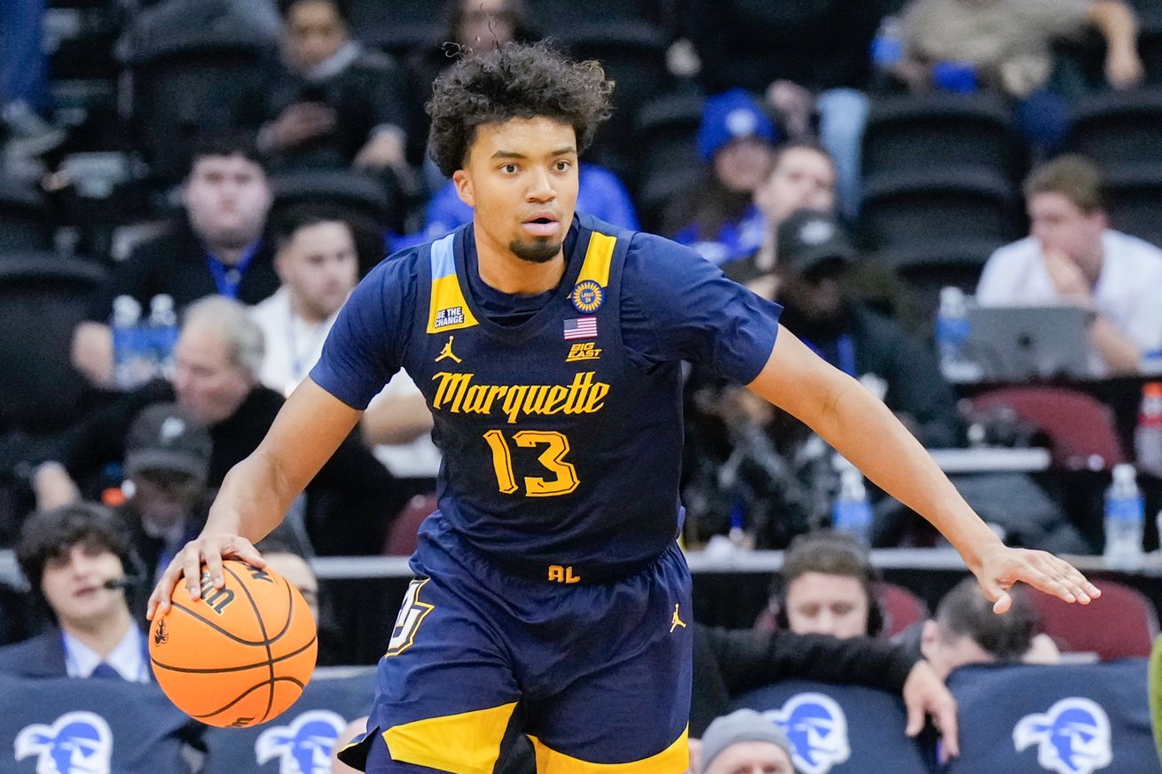 Royce Parham #13 of the Marquette Golden Eagles dribbles the ball against the Seton Hall Pirates in the second half of a college basketball game at Prudential Center on January 21, 2025 in Newark, New Jersey.