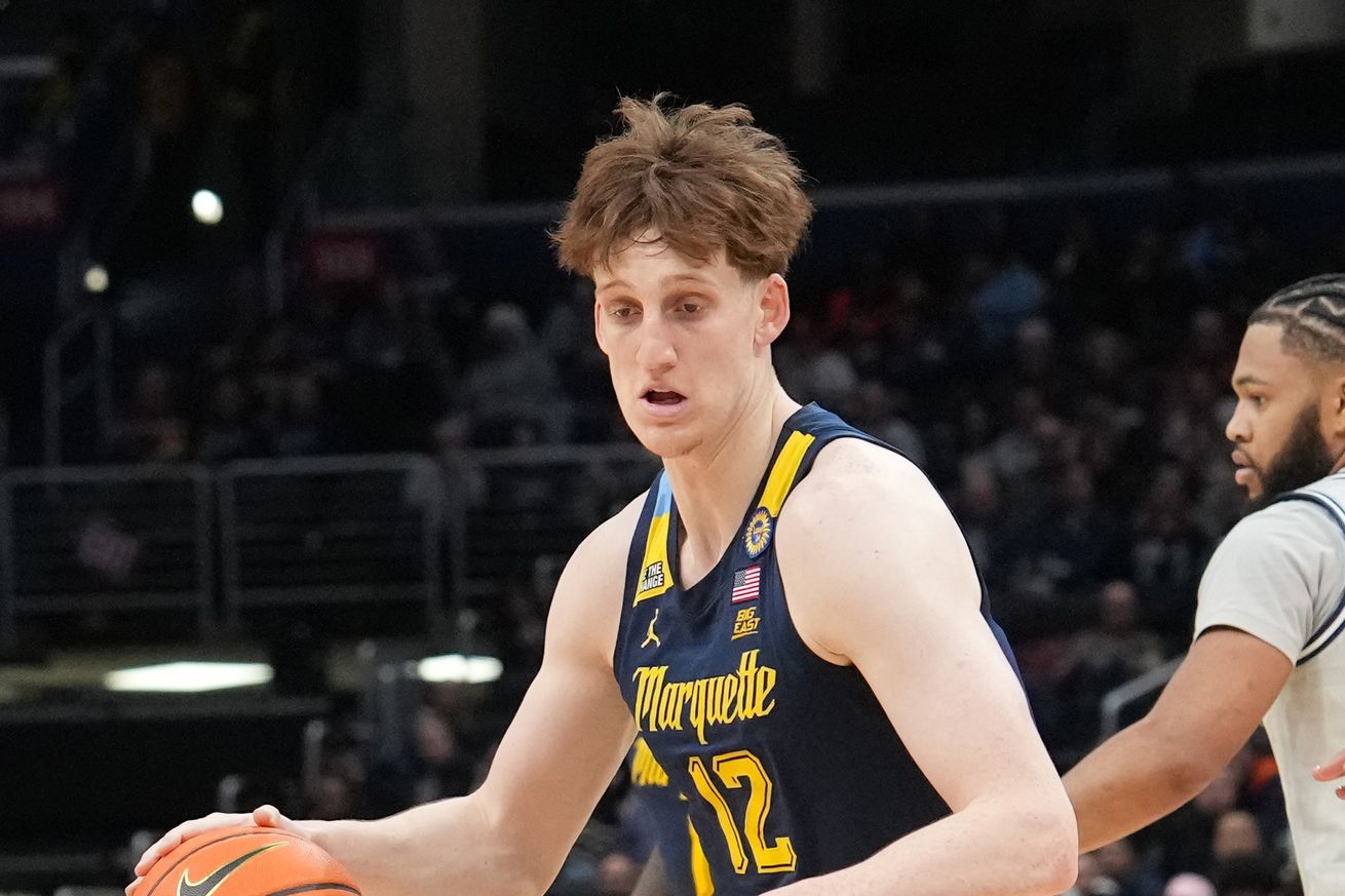 Ben Gold #12 of the Marquette Golden Eagles dribbles the ball during a college basketball game against the Georgetown Hoyas at the Capital One Arena on March 1, 2025 in Washington, DC.