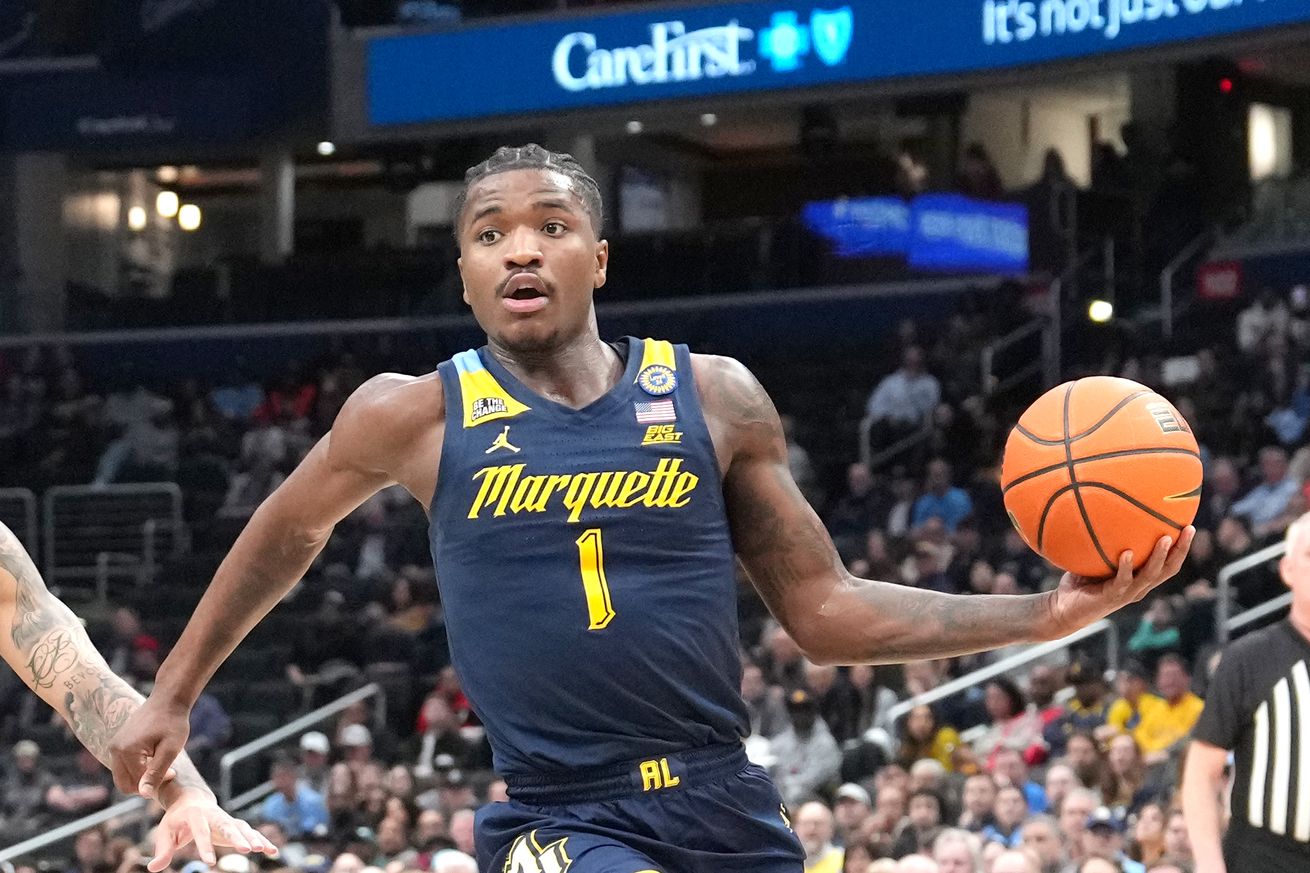 Kam Jones #1 of the Marquette Golden Eagles drives to the basket during a college basketball game against the Georgetown Hoyas at the Capital One Arena on March 1, 2025 in Washington, DC.