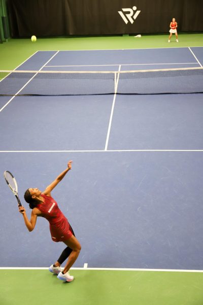 Ariel Johnson serves to her opponent in a match against Illinois at the Nielsen Tennis Stadium on March 9, 2025. 