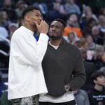 Apr 13, 2025; Milwaukee, Wisconsin, USA; Milwaukee Bucks forward Giannis Antetokounmpo (34) and his brother Milwaukee Bucks forward Thanasis Antetokounmpo talks during a time out against the Detroit Pistons in the second half at Fiserv Forum. Mandatory Credit: Michael McLoone-Imagn Images