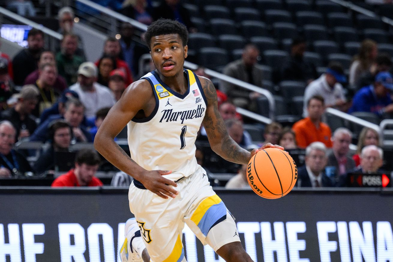 Marquette Golden Eagles guard Kam Jones (1) drives into the lane during the Western Kentucky Hilltoppers game versus the Marquette Golden Eagles in the first round of the NCAA Division 1 Championship on March 22, 2024, at Gainbridge Fieldhouse in Indianapolis, IN.