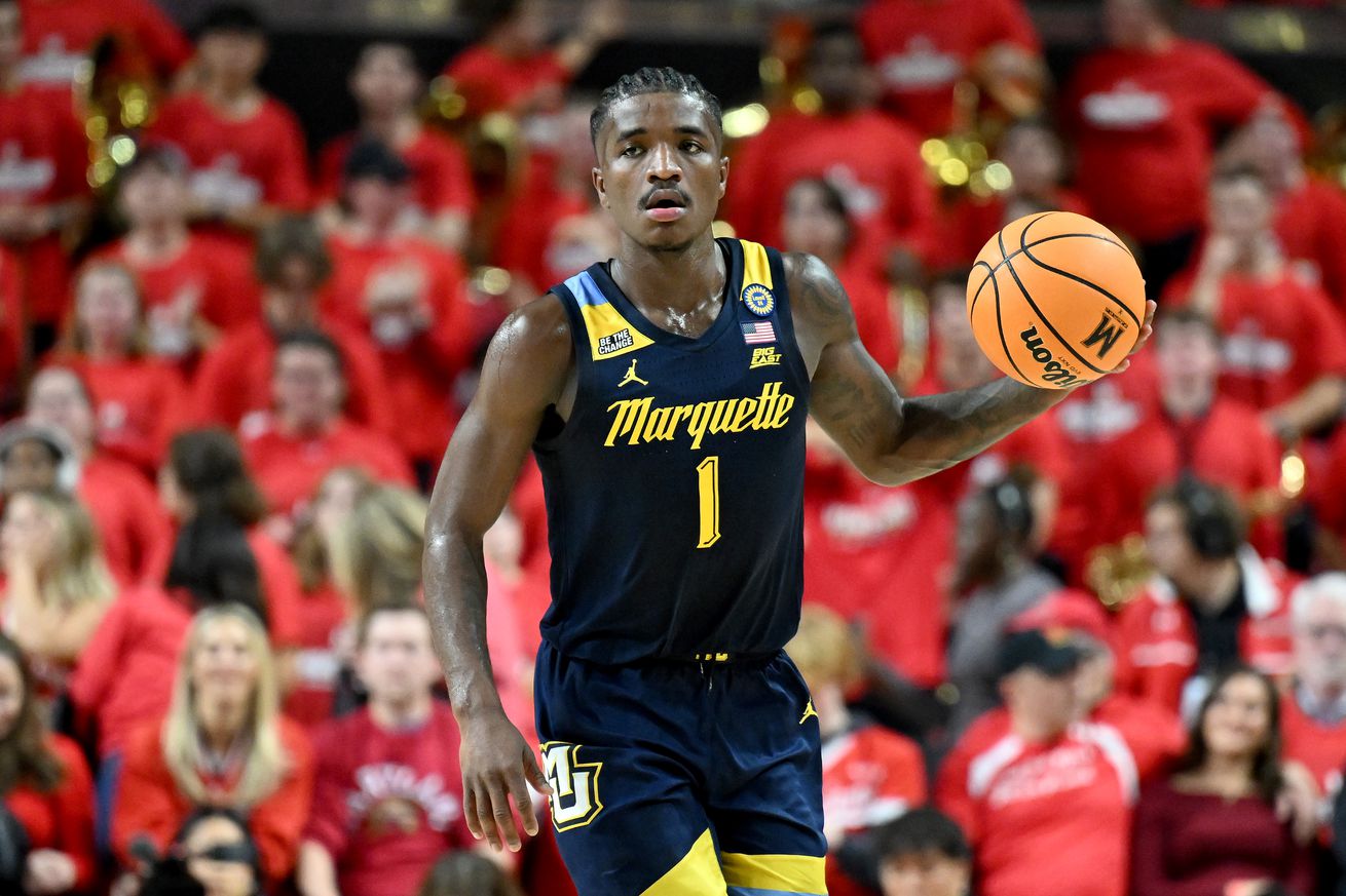 Kam Jones #1 of the Marquette Golden Eagles handles the ball against the Maryland Terrapins at Xfinity Center on November 15, 2024 in College Park, Maryland.