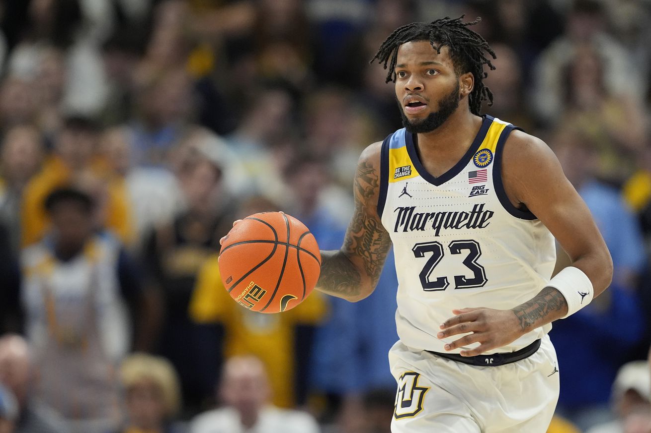 David Joplin #23 of the Marquette Golden Eagles dribbles the ball against the DePaul Blue Demons during the first half at Fiserv Forum on February 11, 2025 in Milwaukee, Wisconsin.