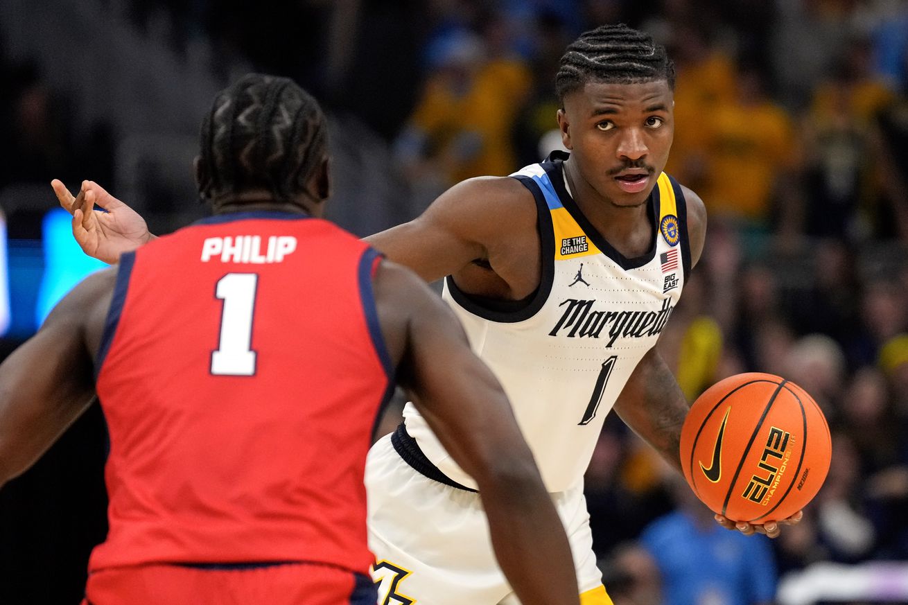 Marquette Golden Eagles guard Kam Jones (1) dribbles the ball against Stony Brook Seawolves guard Sabry Philip (1) during the second half at Fiserv Forum.
