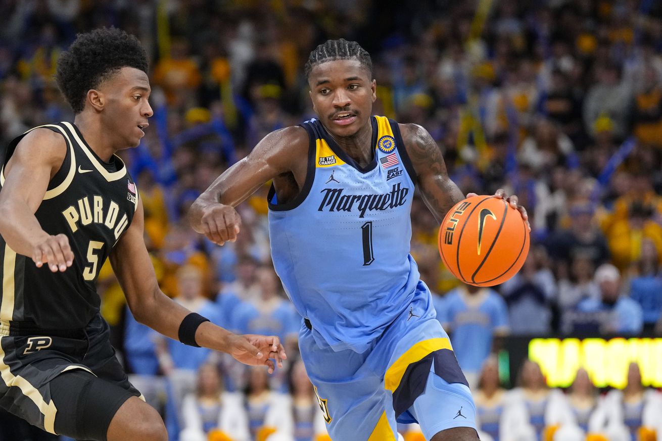 Marquette Golden Eagles guard Kam Jones (1) drives towards the basket against Purdue Boilermakers guard Myles Colvin (5) during the second half at Fiserv Forum.