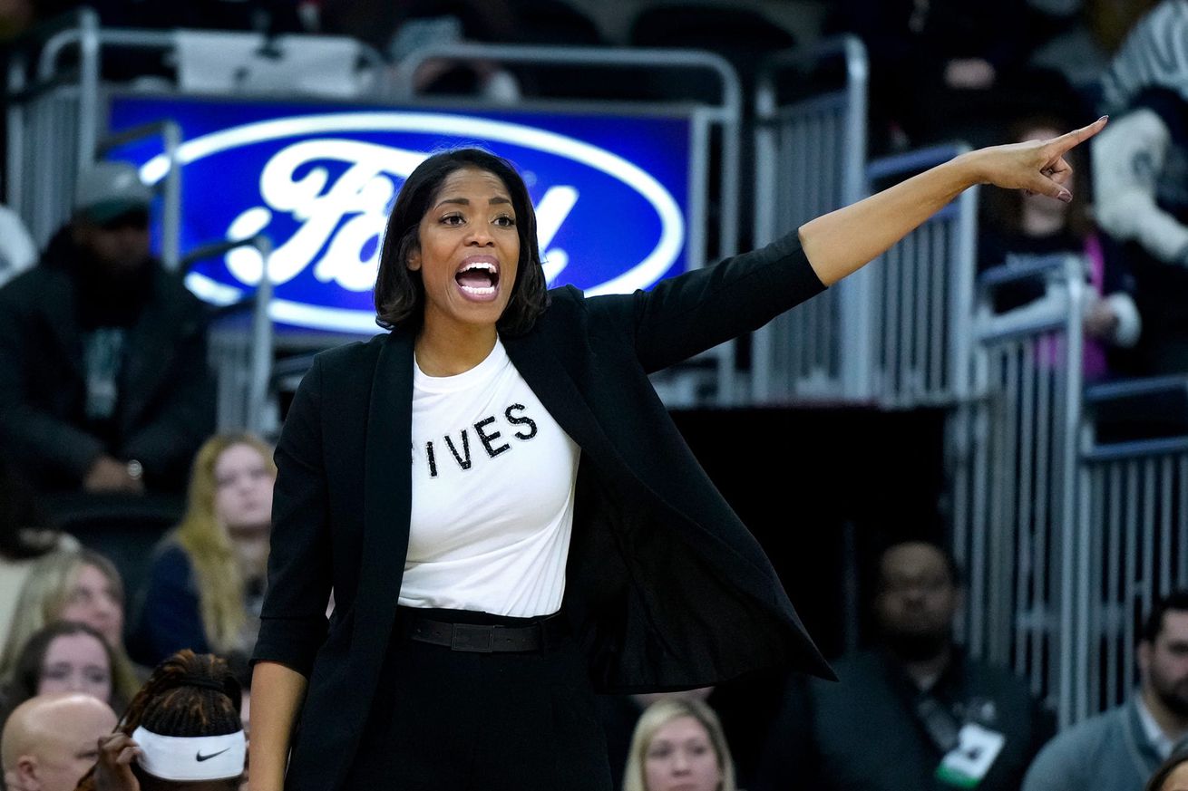 Providence Friars coach Erin Batth trying to keep her team together against UConn from the sidelines.