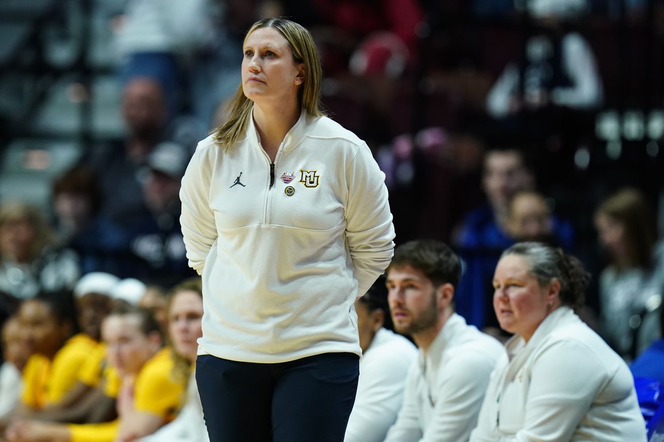 Marquette Golden Eagles head coach Cara Consuegra watches from the sideline as they take on the Villanova Wildcats at Mohegan Sun Arena.