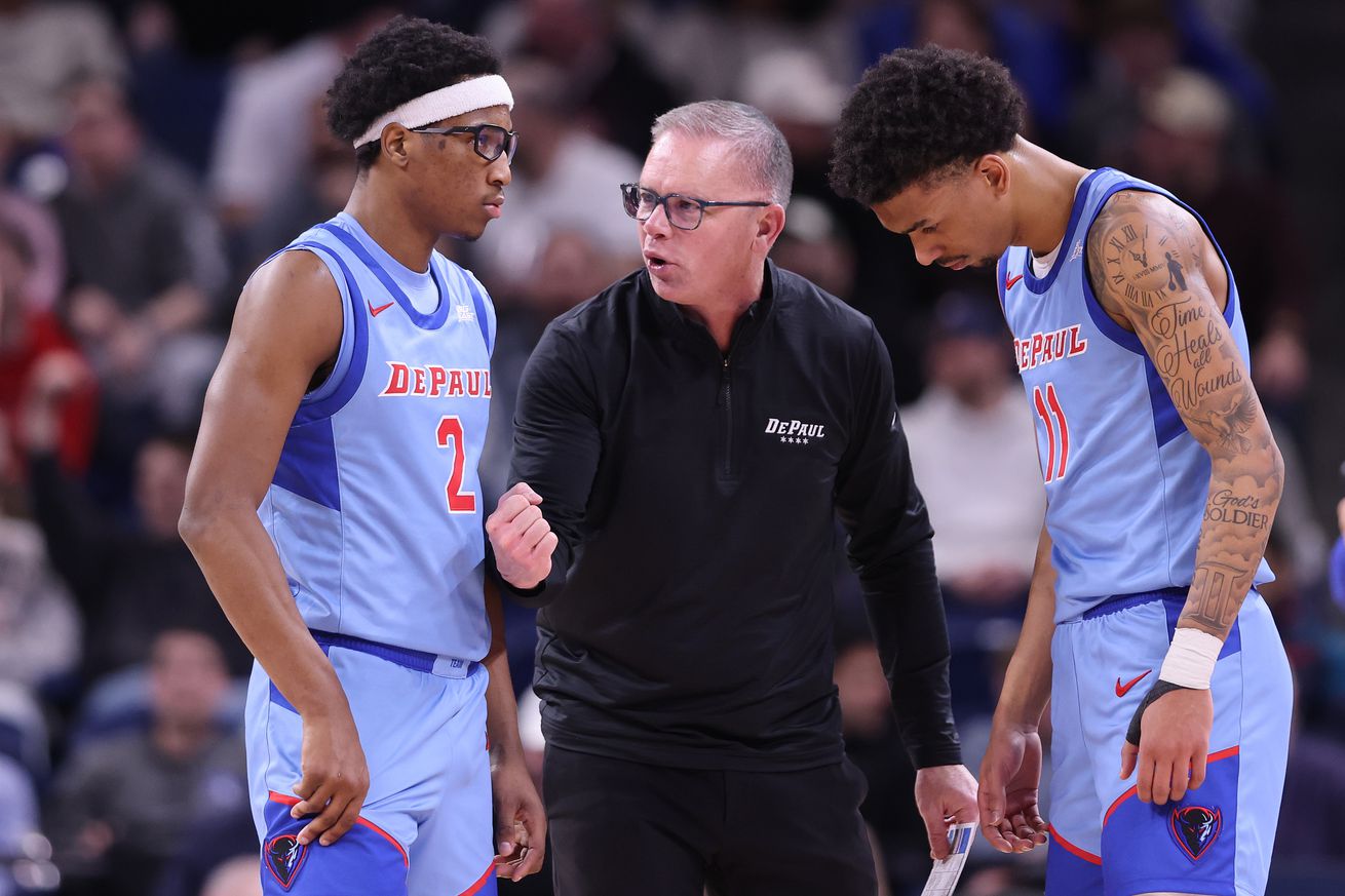 Head coach Chris Holtmann of the DePaul Blue Demons talks with Layden Blocker #2 and CJ Gunn #11 against the St. John’s Red Storm during the second half at Wintrust Arena on February 19, 2025 in Chicago, Illinois.