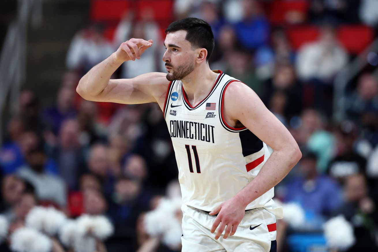 Alex Karaban #11 of the Connecticut Huskies celebrates after a basket against the Oklahoma Sooners during the second half in the first round of the NCAA Men’s Basketball Tournament at Lenovo Center on March 21, 2025 in Raleigh, North Carolina.