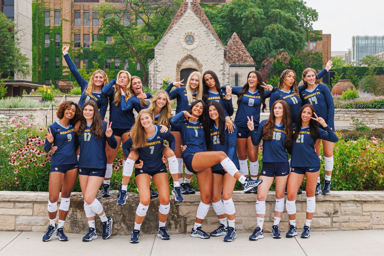 A Marquette volleyball team picture for the 2025 season, taken in front of the St. Joan of Arc Chapel on MU’s campus.