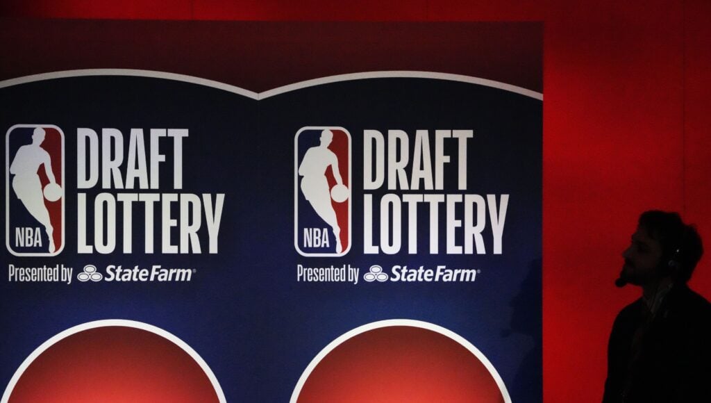 May 12, 2025; Chicago, Illinois, US; A person watches the 2025 NBA Draft Lottery at McCormick Place. Mandatory Credit: David Banks-Imagn Images