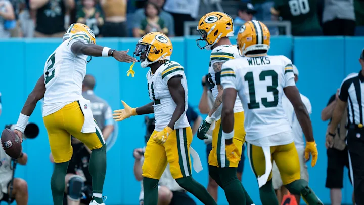 QB Malik Willis celebrates with team