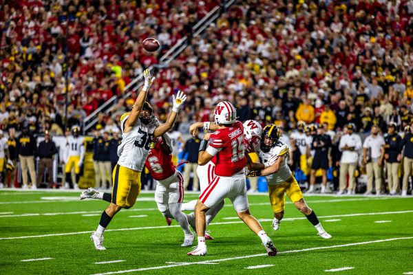 Wisconsin Football: Quarterback Hunter Simmons launches a pass during the 37-0 loss against Iowa. October 11, 2025.