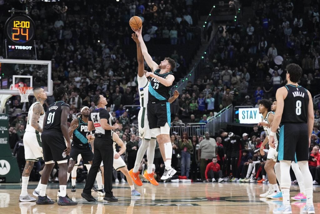 Nov 24, 2025; Milwaukee, Wisconsin, USA; Tip off between Portland Trail Blazers center Donovan Clingan (23) and Milwaukee Bucks center Myles Turner (3) in the first half at Fiserv Forum. Mandatory Credit: Michael McLoone-Imagn Images
