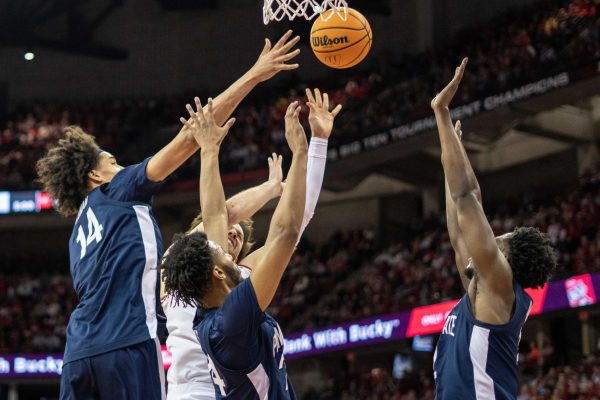 Carter Gilmore attempts a rebound amidst Penn State players. March 8, 2025. 